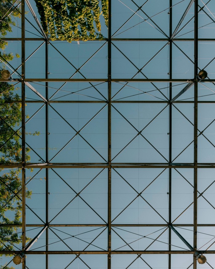  The steel grid of MFO-Park’s open-air roof beneath a blue sky 