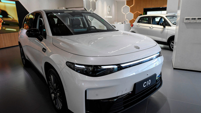 A white Leapmotor C10 model car is displayed at a showroom in its headquarter in Hangzhou, China