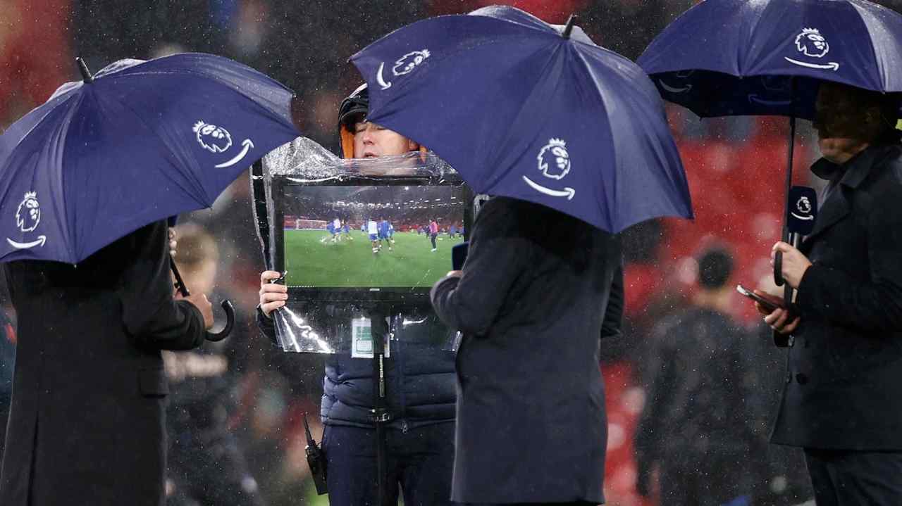 Amazon Prime presenters with a camera operator holding a screen during a Premier League match between Manchester United and Nottingham Forest in December 2022