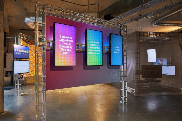 Several digital screens with bright colour gradations in a gallery