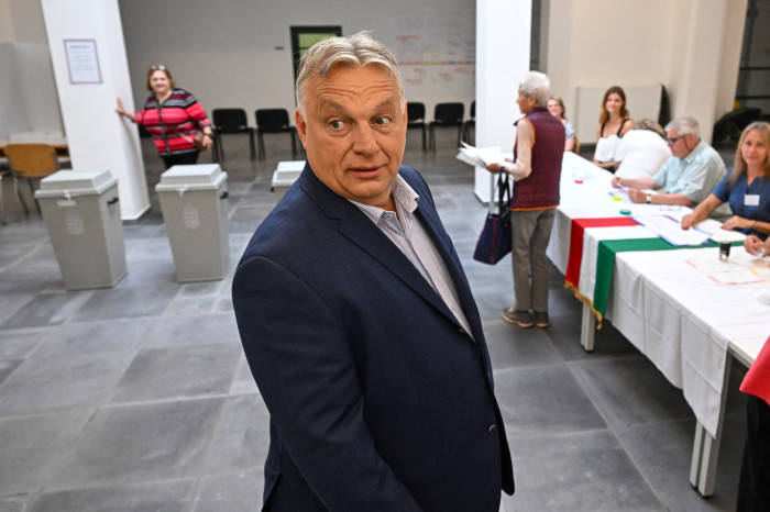 Viktor Orbán arrives to cast his vote for European parliament elections at a polling station in Budapest