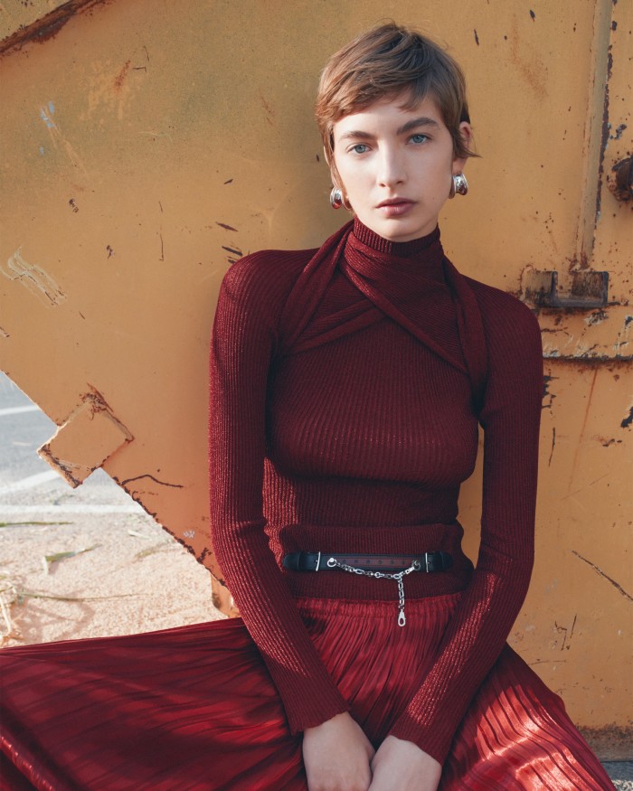 Rolf wears Hermès silk-lamé bolero with integrated scarf, £350, matching jumper, £430, and silk jacquard pleated skirt with chain detail, £1,750