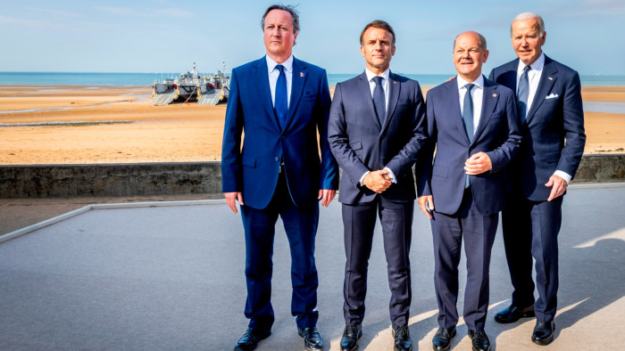 UK foreign secretary Lord David Cameron, French President Emmanuel Macron, German Chancellor Olaf Scholz and US President Joe Biden at the memorial event on Omaha Beach on Thursday