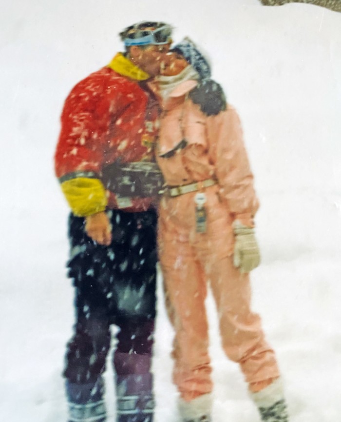 Ducas’s lifelong love of skiing – seen here with her husband, John, in 1992 – is represented by a gondola charm