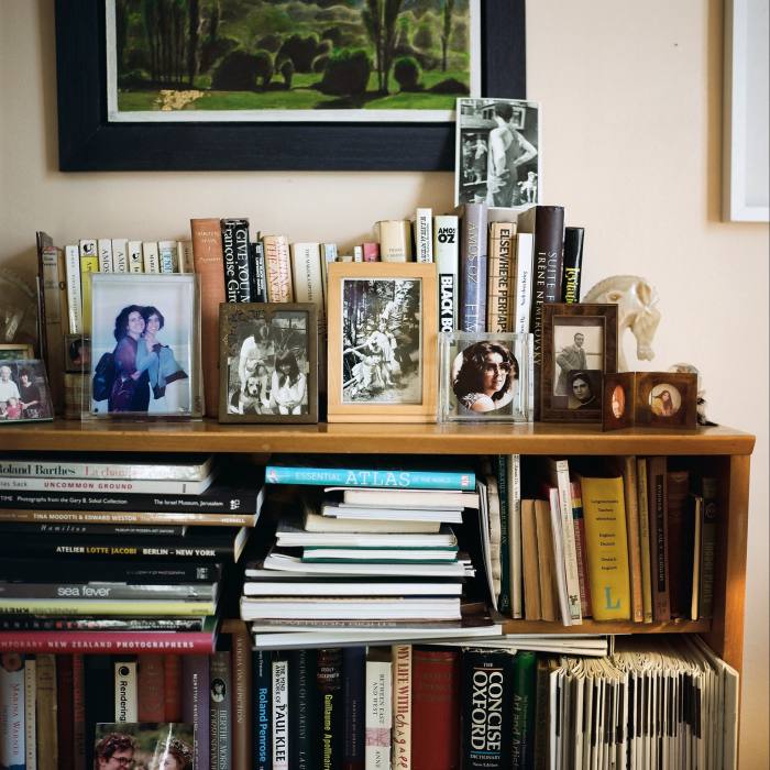 Family photos on a bookshelf in Bohm’s study