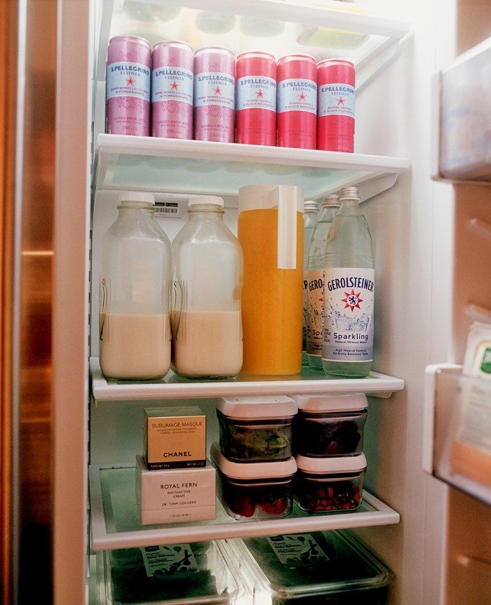 Inside Ambrose’s fridge, with bottles of her homemade nut milk