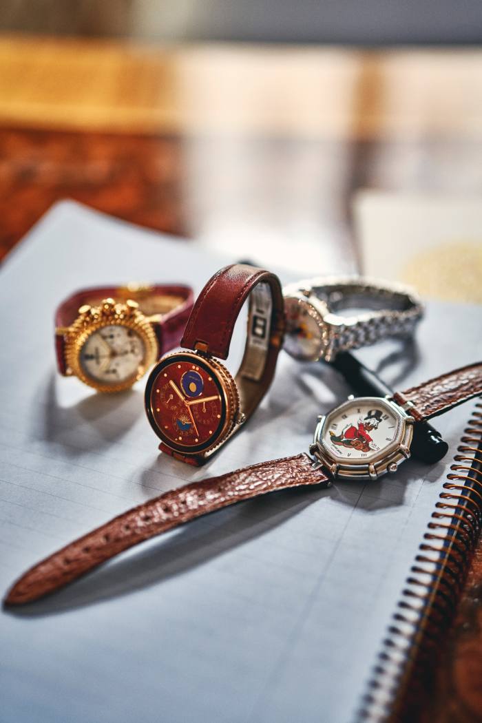 Pieces lying on a notebook from the Genta archive including (centre) the 1984 Gefica Safari watch for hunters and explorers