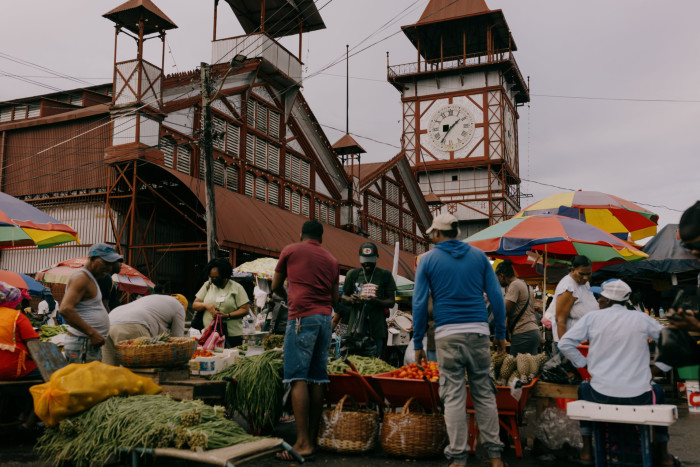 Shoppers browse stalls in Stabroek Market in Georgetown