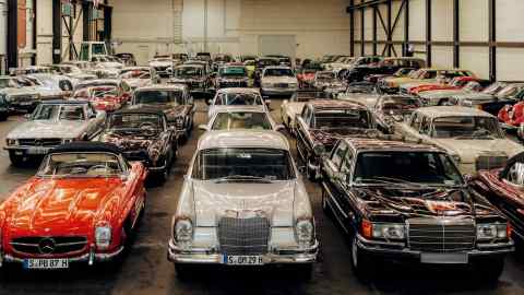 Inside the Mercedes Heilige Hallen with (on front row, from left) a Mercedes 300 SL roadster, a 300 SE and a special armoured 350 SEL