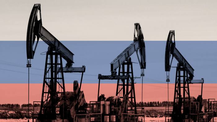 Montage of oil pumping jacks and the Russian flag