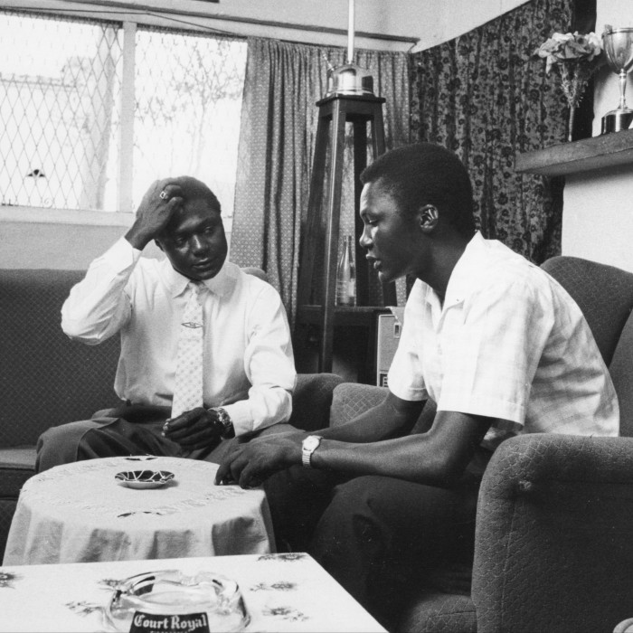Independence activist Tom Mboya speaks with one of his supporters