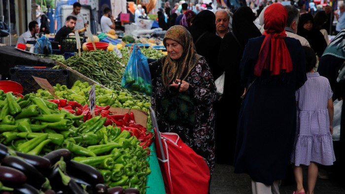 People shop at a fresh market in Istanbul, Turkey