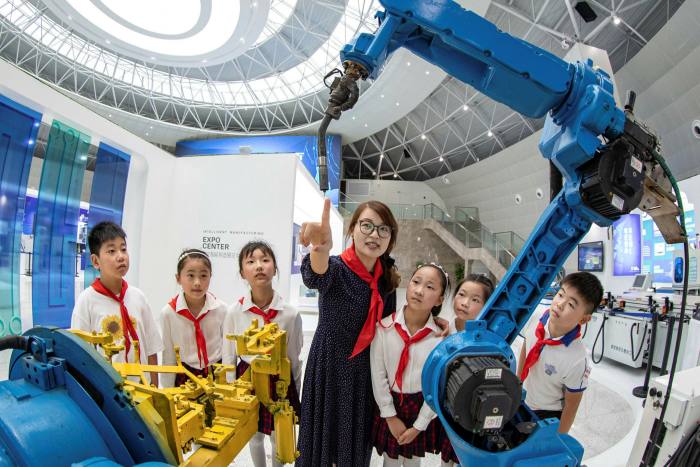 Chinese school children learn about artificial intelligence technology in Haian City. Some measure of global division is possible in semiconductors, AI and other areas where US-China rivalry is intense