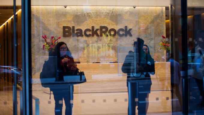 Reception desk of BlackRock seen through the window from outside