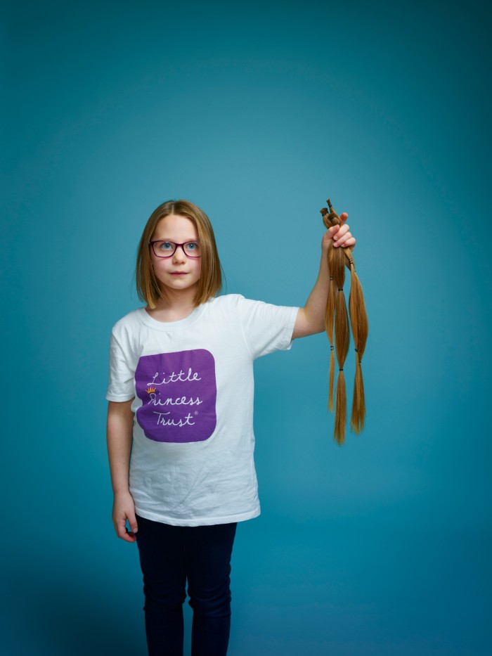 Seven-year-old Mae Bagladi with her 16in hair donation