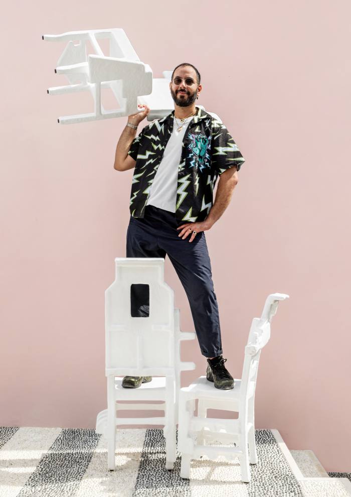 Designer Savvas Laz with his Trashformers Taverna chairs