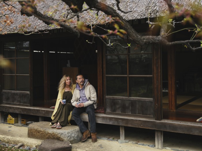 Nakamura and his wife Kelsi drinking coffee on their engawa