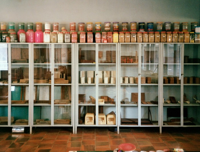 Jars containing natural pigments such as indigo, vermilion, kohl and curcumin