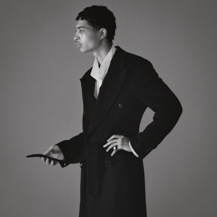 Luis wears Dolce & Gabbana cashmere coat, £4,850. Issey Miyake cotton shirt, £380. Ring and earring, stylist’s own