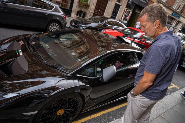 A spotter admires a Lamborghini Huracán STO