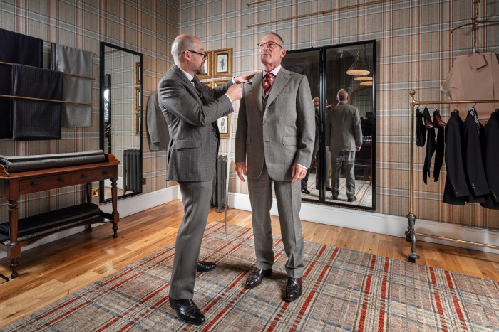 Anthony Peck has his suit fitted by Huntsman’s head cutter, Dario Carnera, at the Savile Row tailor