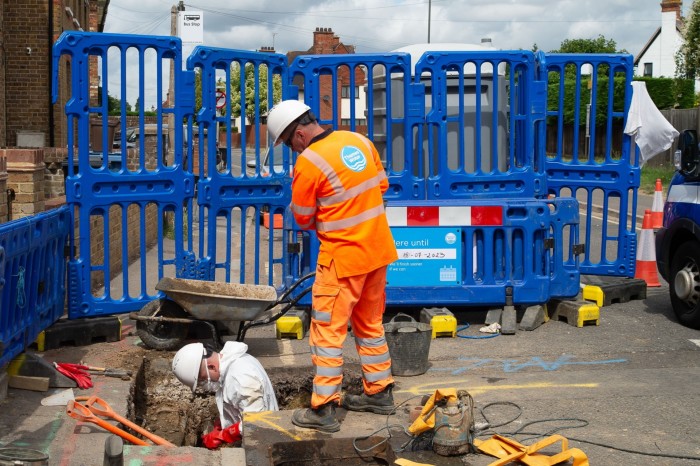 Thames Water repairmen out in Burnham, Slough fixing sewers