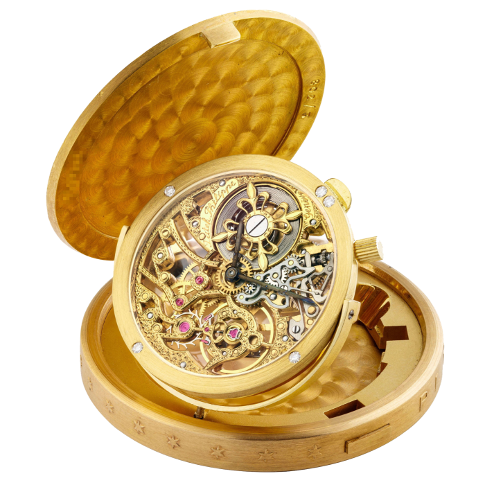 A gold coin watch showing its interior machinery