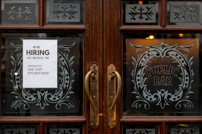 A “We are hiring” sign in the window of a pub in Westminster on June 04, 2021 in London, England. 