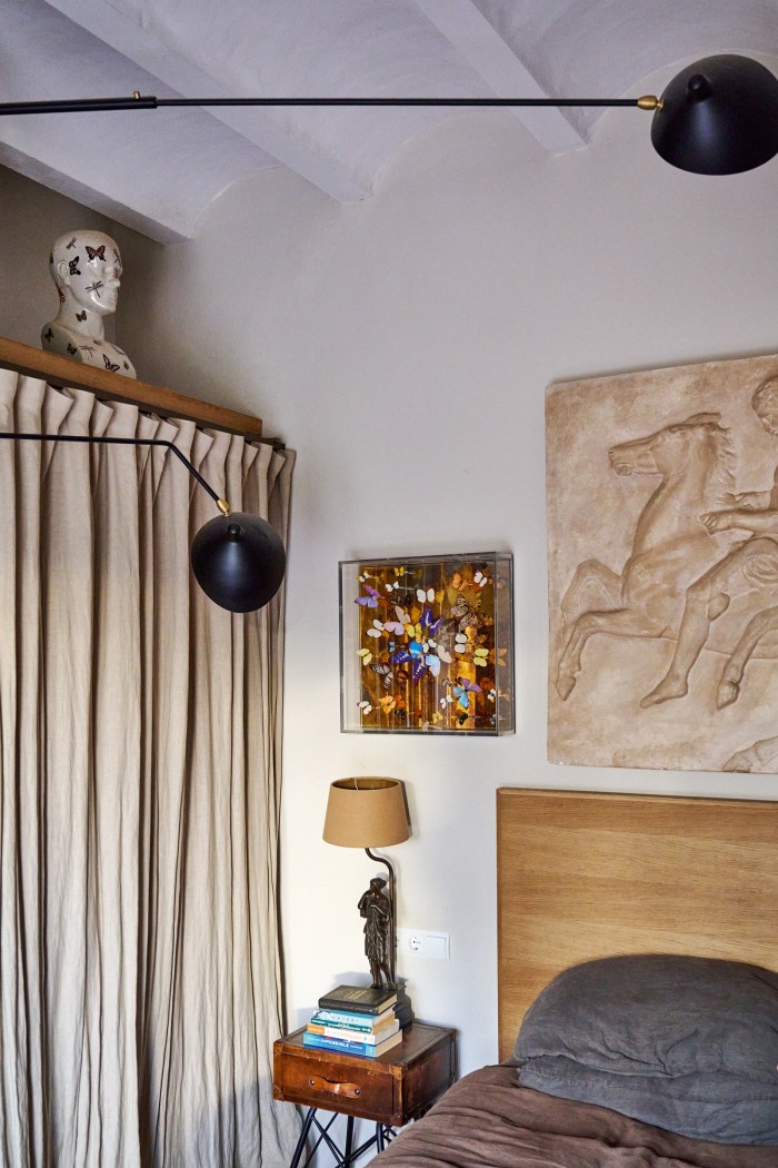 A Neo-Romanesque piece found in the south of France hanging over his bed