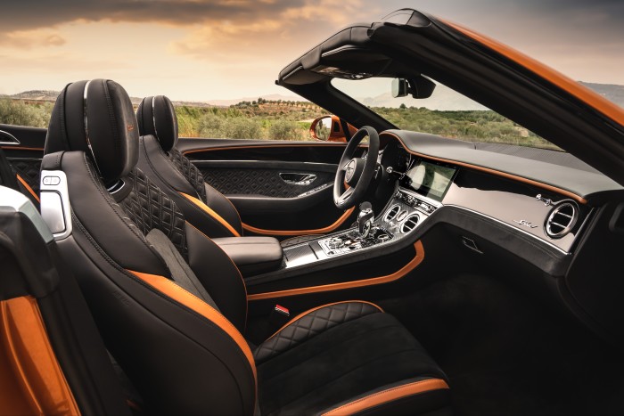 The interior features two-tone leather and Alcantara seats with diamond-quilted upholstery and embroidered Speed headrests