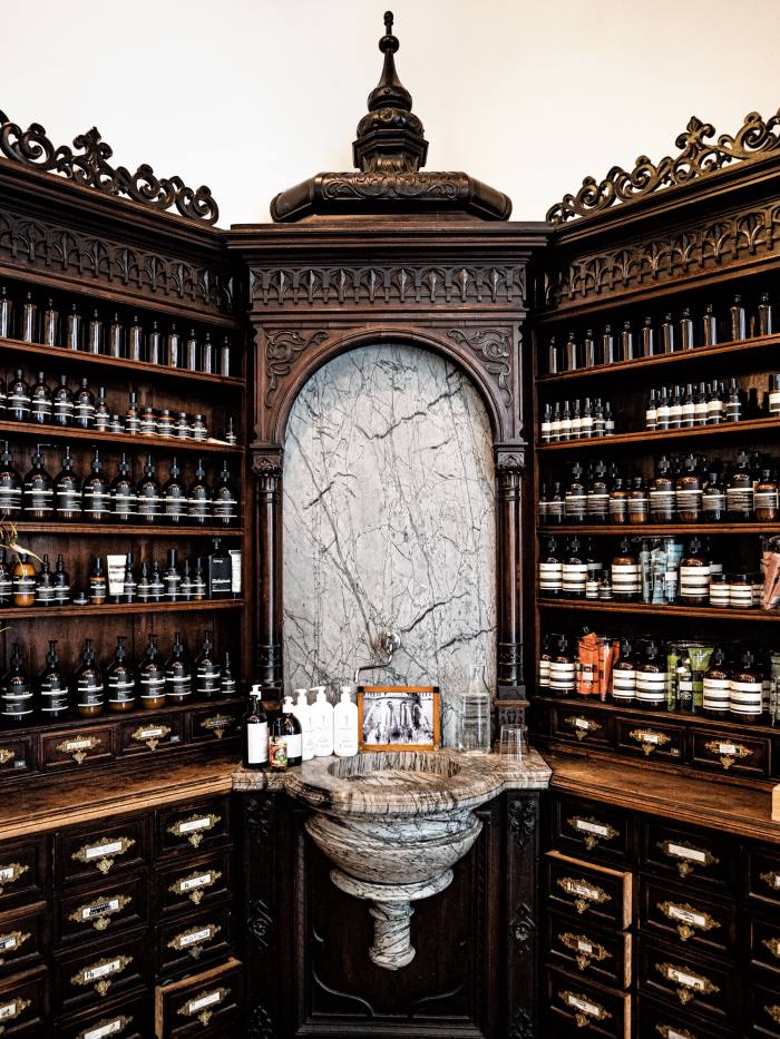 The original 1886 apothecary cabinet with its marble fountain