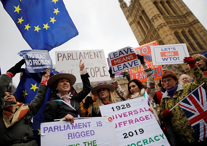 Pro-Brexit demonstrators outside Westminster in London, January 2019. Having delivered the ‘pure’ Brexit he promised Leave voters, Johnson says he will build a new, agile British economy, focused on AI, robotics and biotech