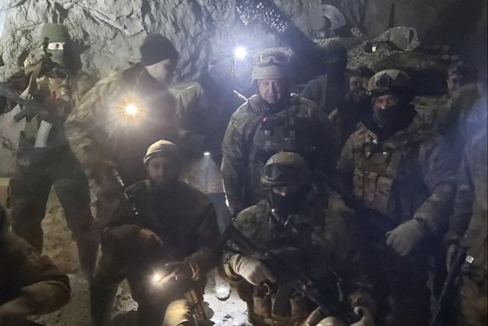 Prigozhin poses with members of his mercenary group in Soledar, Ukraine. Prigozhin spent years denying the group’s very existence, until a video emerged of him trying to recruit prisoners in a Russian jail