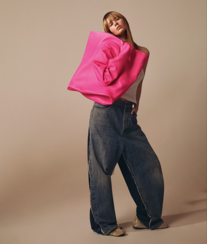 Balenciaga leather Glove tote, €3,400, denim baggy trousers, €1,800, and glitter fabric Leopold flats, €750. Alex Eagle cotton top, stylist’s own