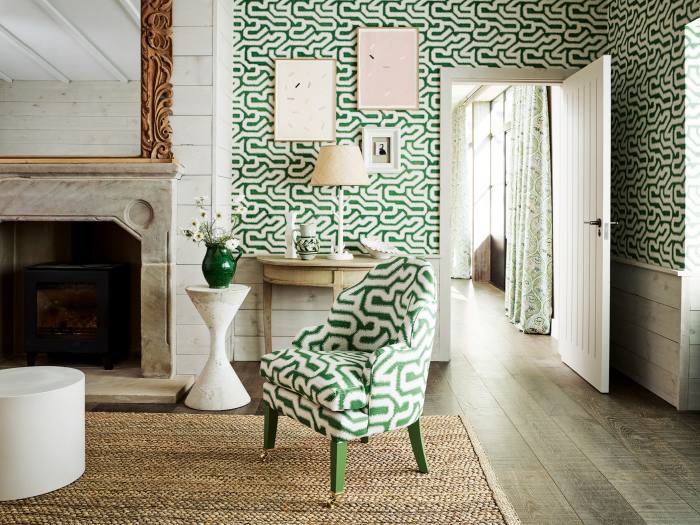 Rapture & Wright Albaicin Palm wallpaper, £26 a metre, and fabric (on chair), £100 a metre. Curtains in Soldanelle Vert de Gris fabric, £139 a metre. Plaster lamp, £850
