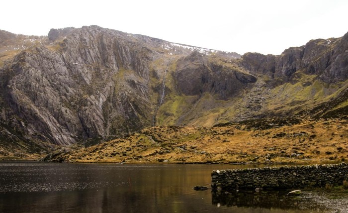 The waters of Llyn (Lake) Idwal, with rocky crags behind them
