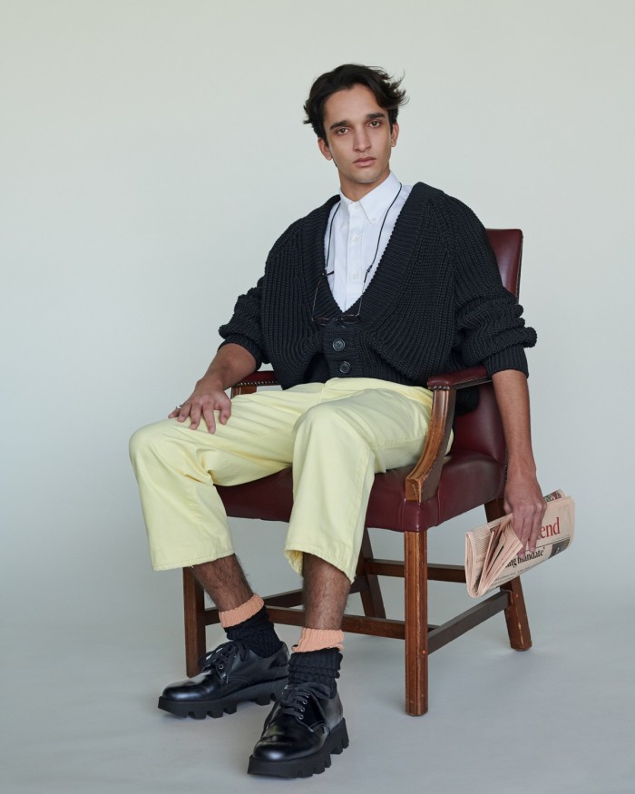 Noah wears Prada cotton cardigan, £880, cotton shirt, £510, denim trousers, £545, cotton socks, £140, and leather shoes, £610. Cutler and Gross glasses, £295. Bunney hammered 925-silver signet ring, £360, from doverstreetmarket.com