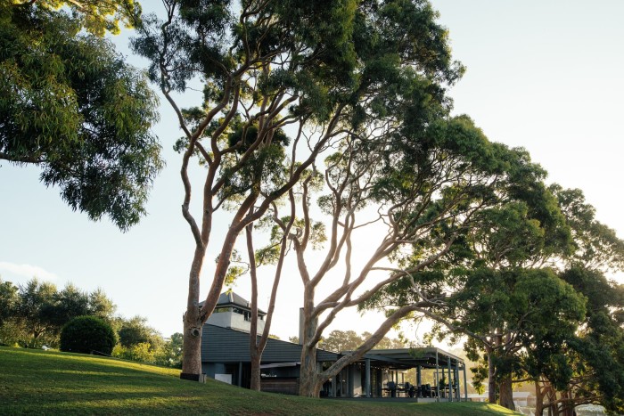 Polperro’s restaurant is set among gum trees, with a deck looking over vines and bushland