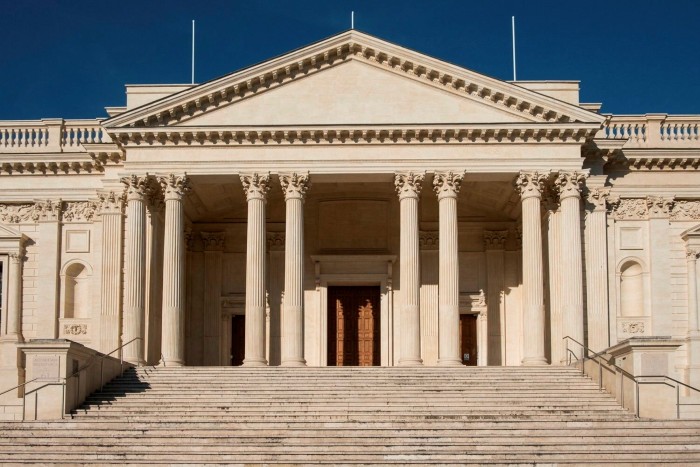The portico and steps of a grand neoclassical building