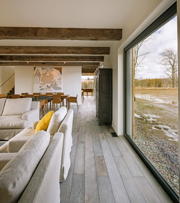 Heavy beams add texture to the interior in the Townships Farmhouse