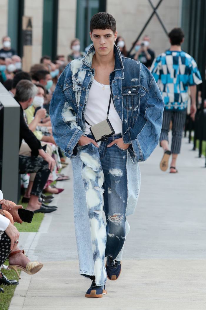 Dolce & Gabbana denim jacket, £2,350, tank top, £145, jeans, £1,300, and sneakers, £625