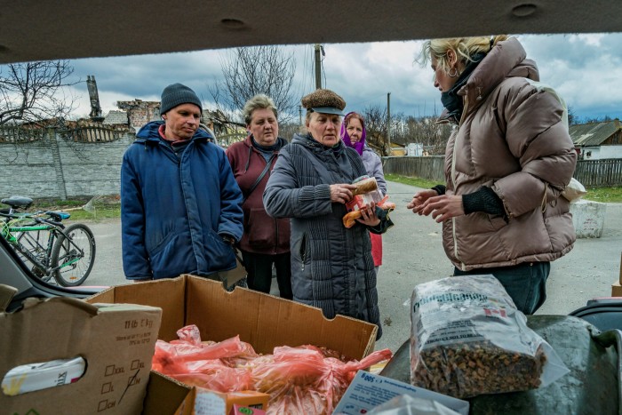 Volunteers assist civilians in Novoselivka, a village on outskirts of Chernihiv