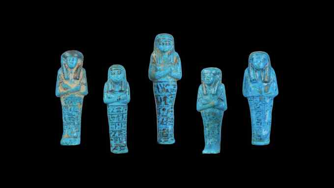Small bright blue sarcophagus-shaped ceramics