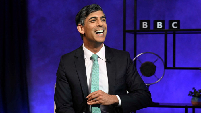 Rishi Sunak smiling during an interview with Nick Robinson on the Panorama television programme