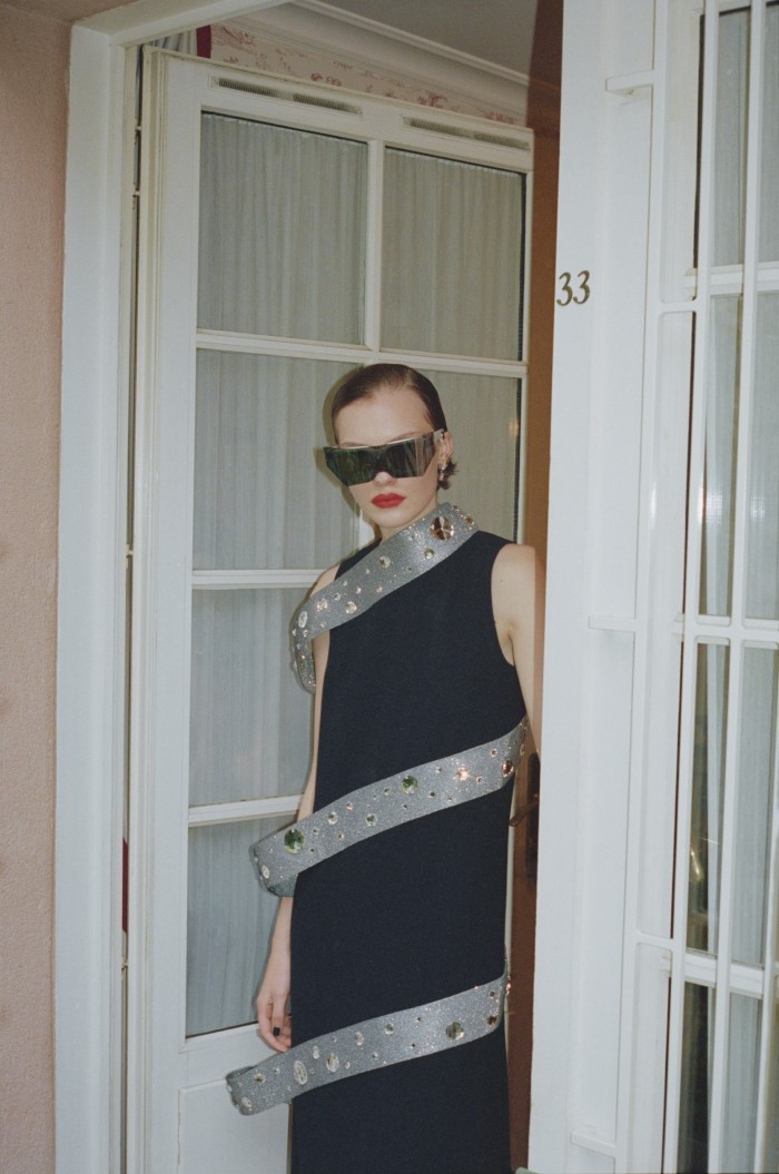 Penelope Ternes wears Pierre Cardin crystal-embellished Oeko-tex polyester dress and acetate Evolution 10 sunglasses, both POA. Chaumet white- and yellow-gold and diamond earrings, POA