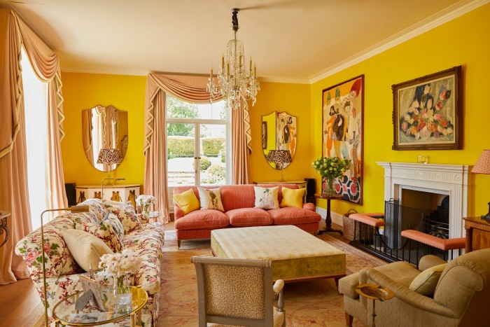 The “Post-it yellow” living room, with paintings on the right wall by (from left) Ella Walker and Jacqueline Marval