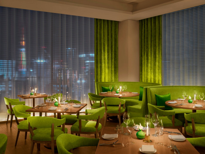 Lime-green seating and curtains in the hotel’s Sophie restaurant