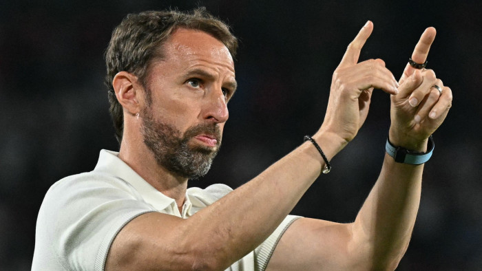 England’s head coach Gareth Southgate gestures to fans 
