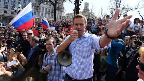Alexei Navalny addresses supporters during an unauthorized anti-Putin rally in May, 2018, in Moscow
