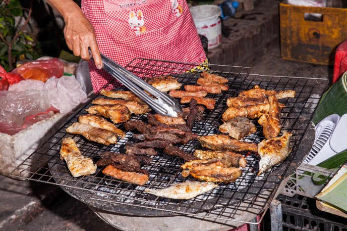 A grilled-meat stall at Luang Prabang’s morning market